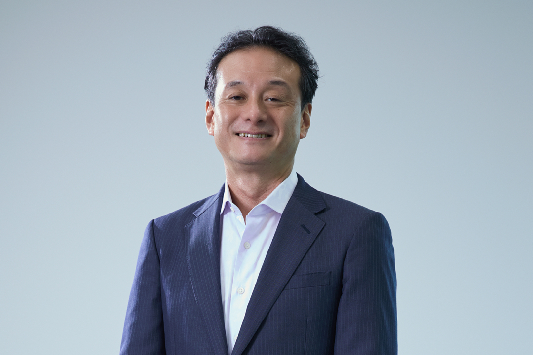 上席執行役員（市場開発本部 本部長） 小澤 現の写真です。